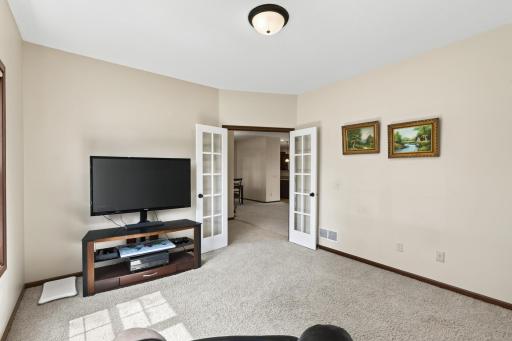 Den: Private den with French doors, perfect for a home office or flex space.
