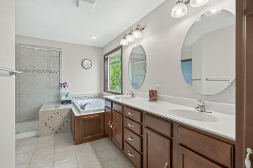 Primary Bath: Private primary bath featuring a relaxing jetted tub and separate walk-in shower.