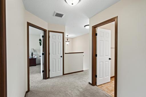 Upper Level: Spacious upper level featuring four bedrooms, a full bathroom, and a large laundry room for added convenience.