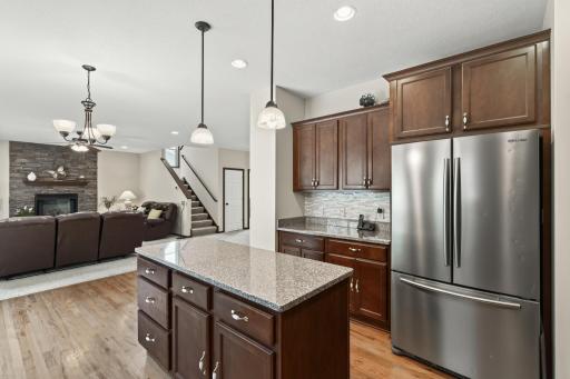 Kitchen: Beautiful kitchen featuring a spacious center island with granite countertops and ample cabinetry for storage.
