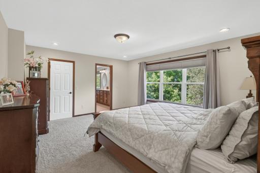 Primary Bedroom: Large primary bedroom with plenty of space for a king-size bed and additional furnishings.