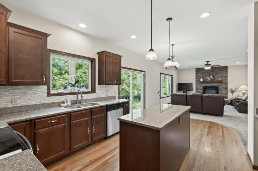 Kitchen: Beautiful kitchen featuring a spacious center island with granite countertops and ample cabinetry for storage.