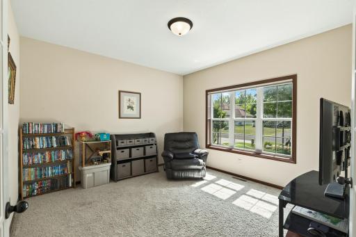 Den: Private den with French doors, perfect for a home office or flex space.