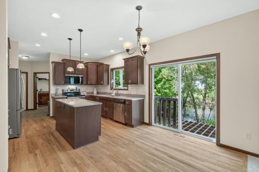 Kitchen: Beautiful kitchen featuring a spacious center island with granite countertops and ample cabinetry for storage.
