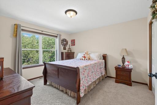 Bedroom 4: Well-sized fourth bedroom with ample natural light and closet space.