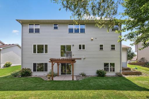 Backyard: Oversized backyard overlooking the pond, offering peaceful views and plenty of outdoor space.