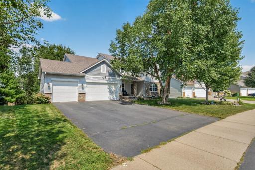 Front Exterior: Beautiful curb appeal with a welcoming front entry and well-maintained landscaping.