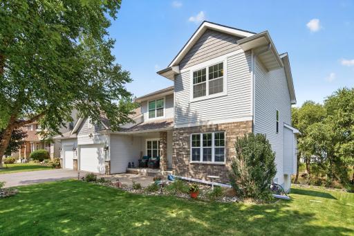 Front Exterior: Beautiful curb appeal with a welcoming front entry and well-maintained landscaping.