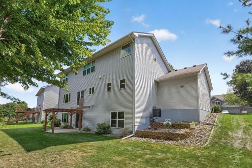 Backyard: Oversized backyard overlooking the pond, offering peaceful views and plenty of outdoor space.