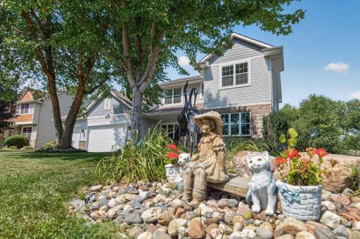 Front Exterior: Beautiful curb appeal with a welcoming front entry and well-maintained landscaping.