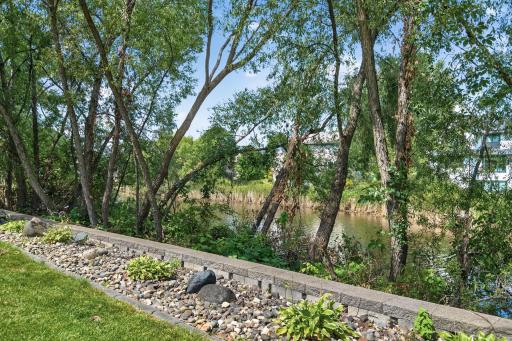 Backyard: Oversized backyard overlooking the pond, offering peaceful views and plenty of outdoor space.