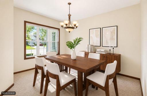 Bright and inviting informal dining area (staged) with an open layout, perfect for everyday meals and casual gatherings.