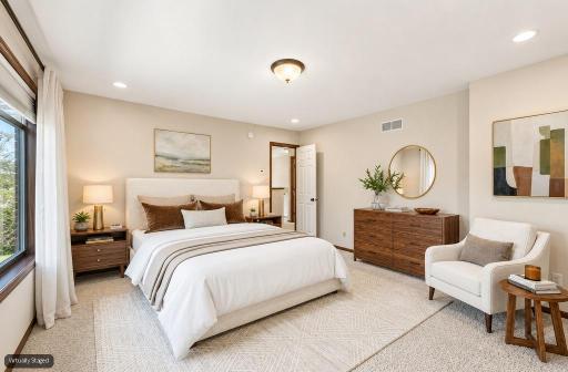 Primary Bedroom (staged): Large primary bedroom with plenty of space for a king-size bed and additional furnishings.