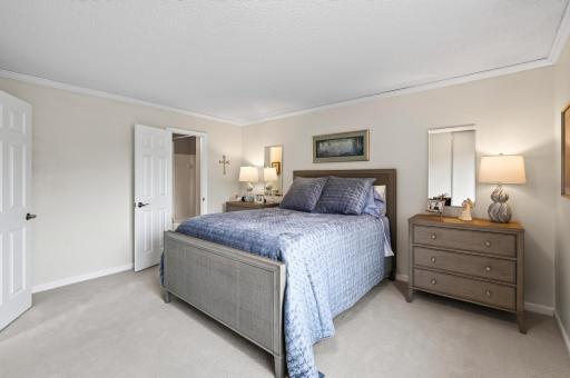 Sun-filled primary bedroom with walk-thru full bath