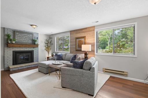 The lower level family features daylight windows and a cozy fireplace