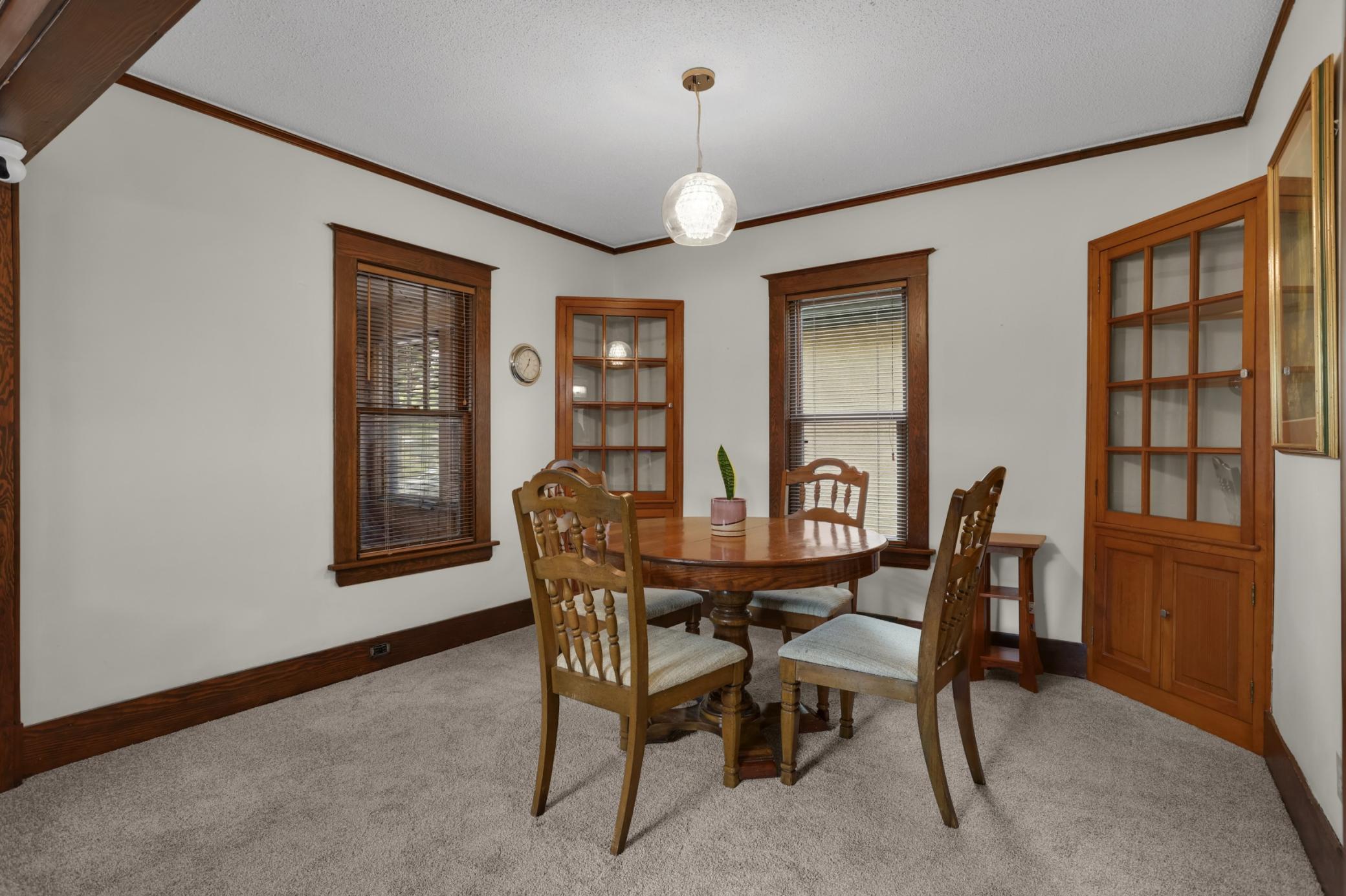 Dining room with beautiful built-in glass front cabinets