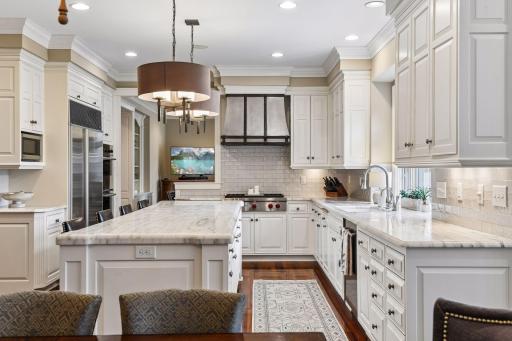 Luxury appliances, marble countertops and a huge island to gather!