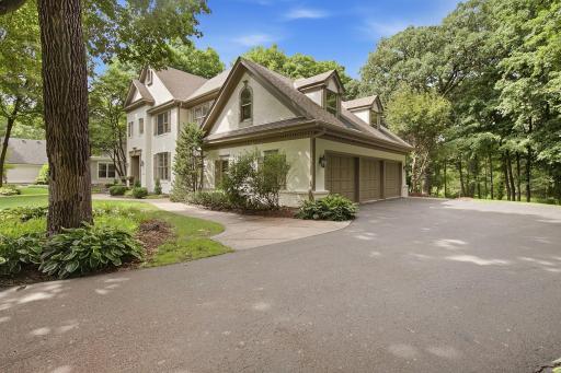 Picturesque setting on .52 acres of a private wooded lot