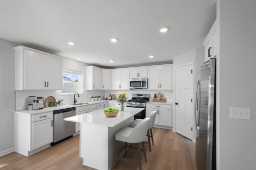 All GE SS appliances included! Microwave vents to exterior! Soft close cabinets and drawers throughout home! Spacious walk-in pantry! Photos are for representational purposes. Styles, colors and selections may vary.
