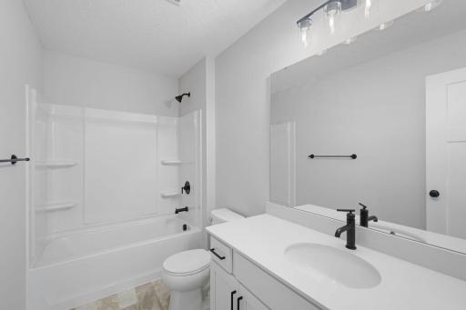 Stylish full bath conveniently located just steps from each of the three upper level bedrooms! Photos are for representational purposes. Styles, colors and selections may vary.