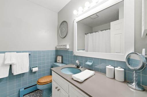 A spacious full bathroom conveniently serves all four upper-level bedrooms.