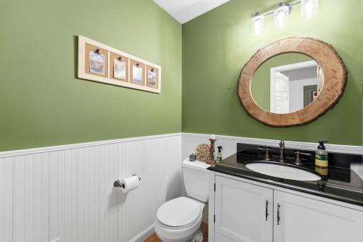 A conveniently located main-level bathroom adds function for residents and guests.