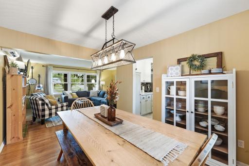 The dining area flows naturally between the living room and kitchen
