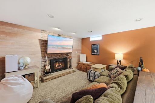 A gas-burning fireplace brings warmth and character to the lower-level living space.