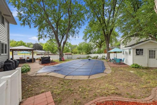 The in-ground pool creates the foundation for memorable Minnesota summers at home.