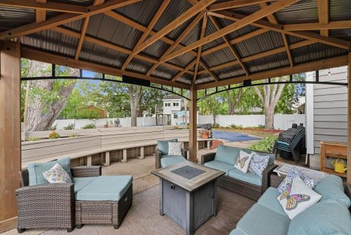 A fully fenced backyard with distinct spaces for swimming, gardening, relaxing and entertaining.