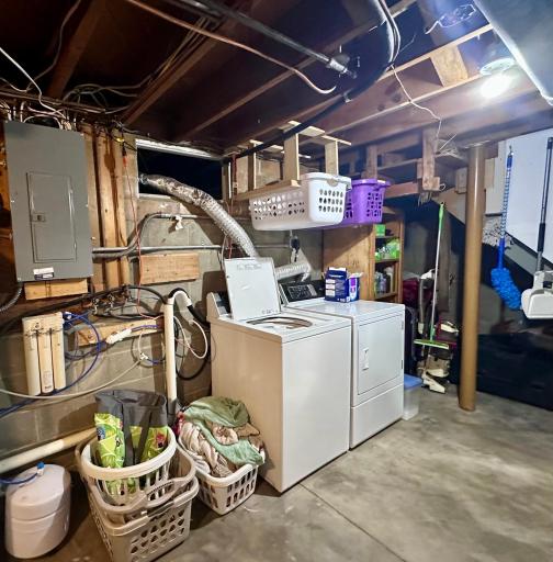 Lower-level laundry room with above storage for laundry baskets!