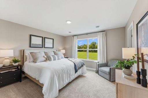 Luxury bedroom suite with private bath and walk-in closet. *Photo of similar model home. Color and options may differ.