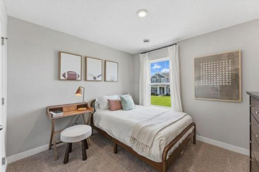 Secondary bedroom on the upper level of the Ferguson floor plan. *Photo of similar model home. Color and options may differ.