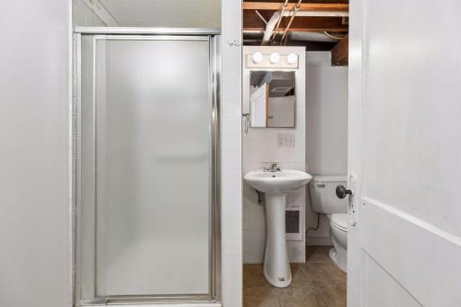 Second bathroom can be found just across from the basement bedroom..