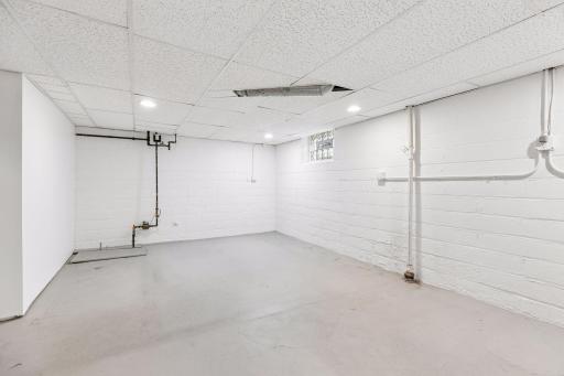 Alternate view of the unfinished basement space.