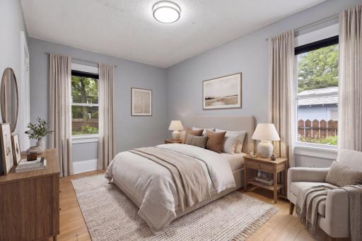 Main level primary bedroom virtually staged using AI - please refer to floorplan for room dimensions and sizing.