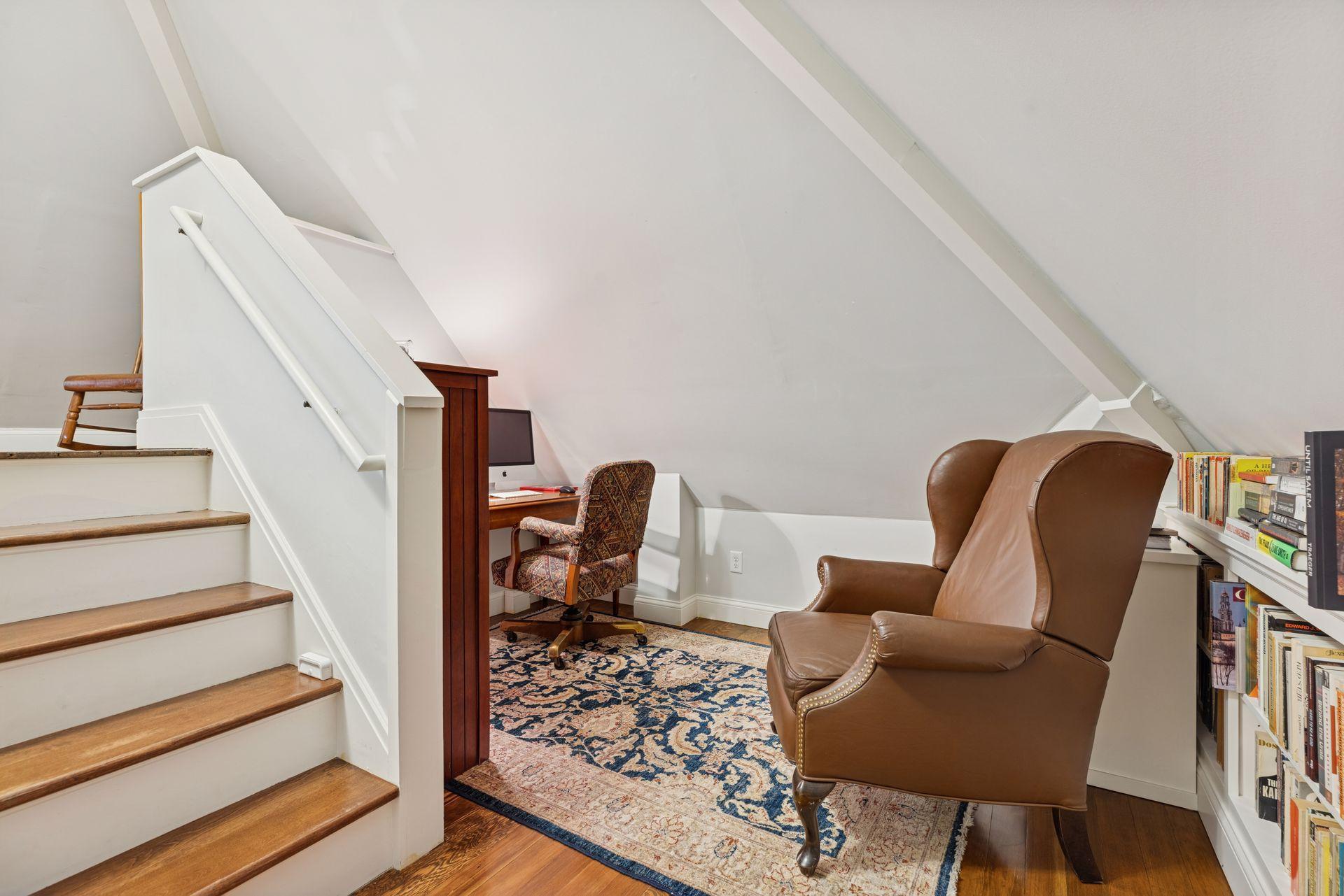 A flexible landing space on the way to upper level, ideal for a reading nook or additional workspace