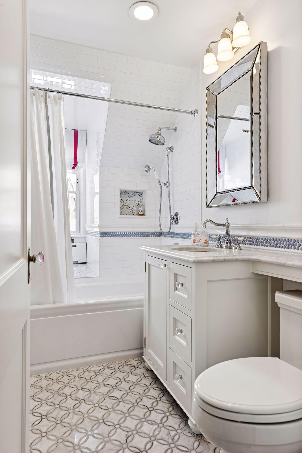 One of three bedrooms featuring a private en suite bath
