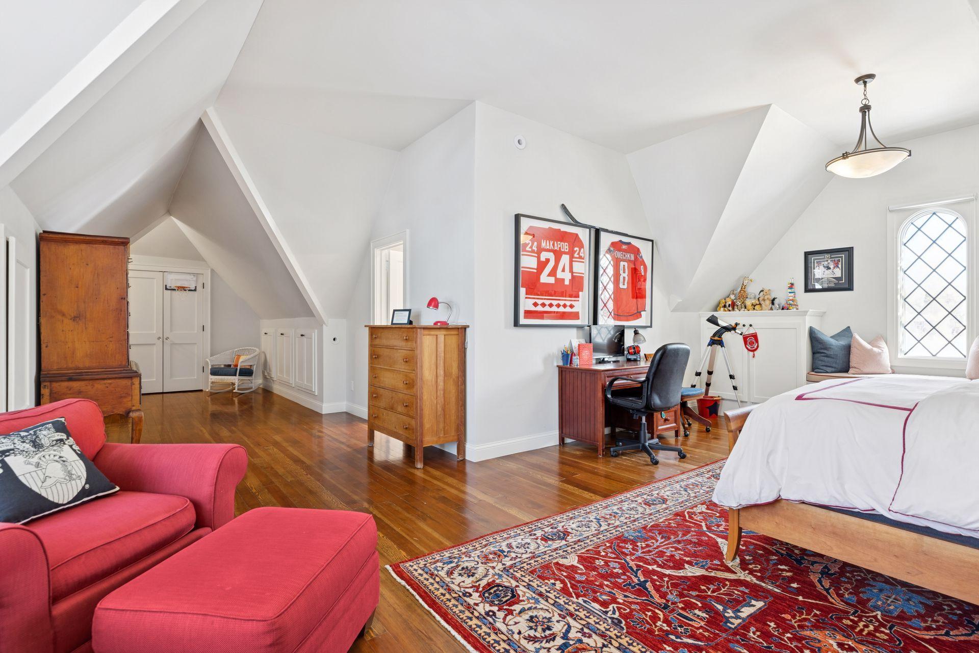 This spacious upper-level 5th bedroom is filled with natural light