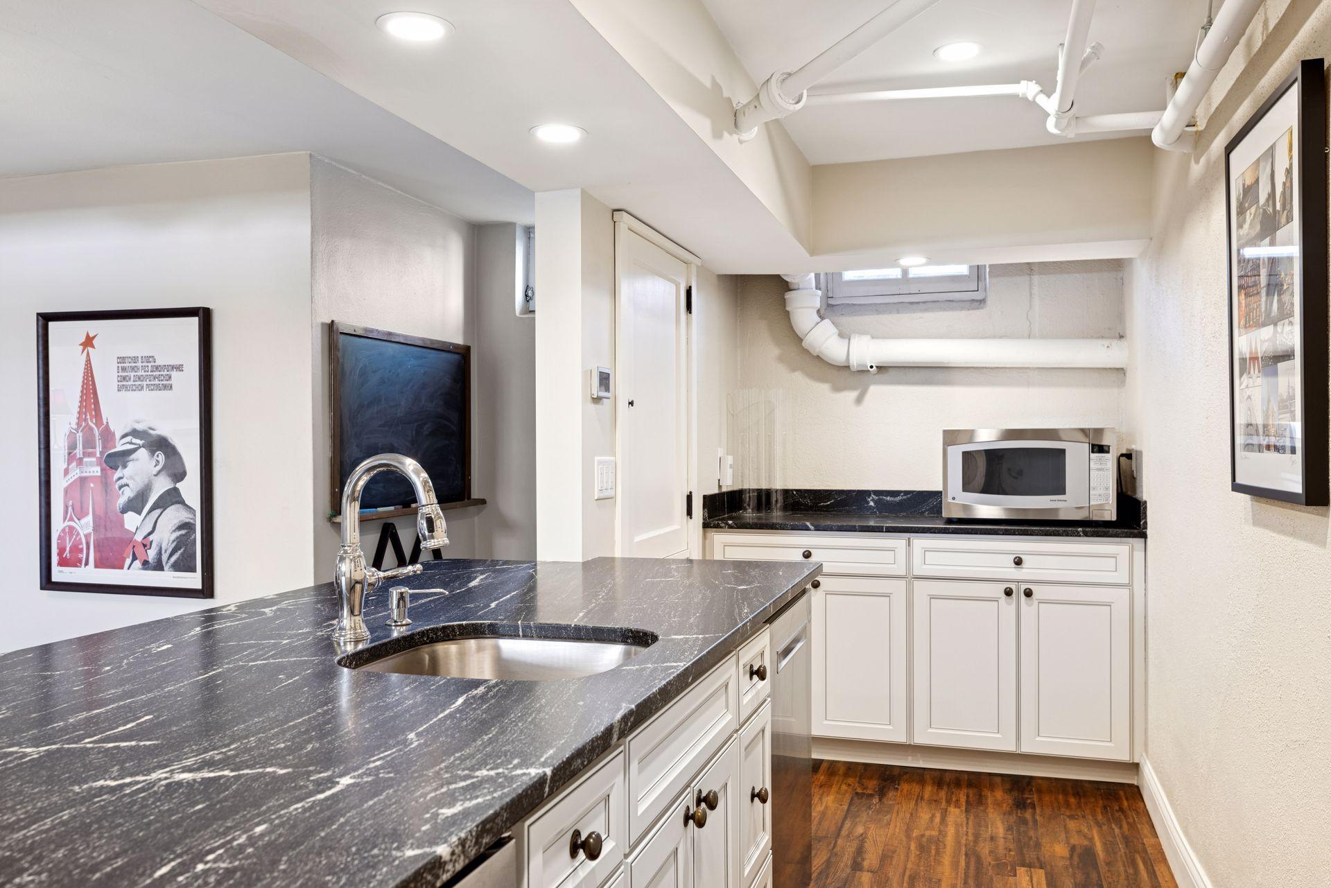 Storage is abundant throughout the home, with four additional lower-level areas—including two storage closets, an extra-large, meticulously maintained utility room, and a lower-level laundry—offering ample space for hobbies, gear, and everyday essent