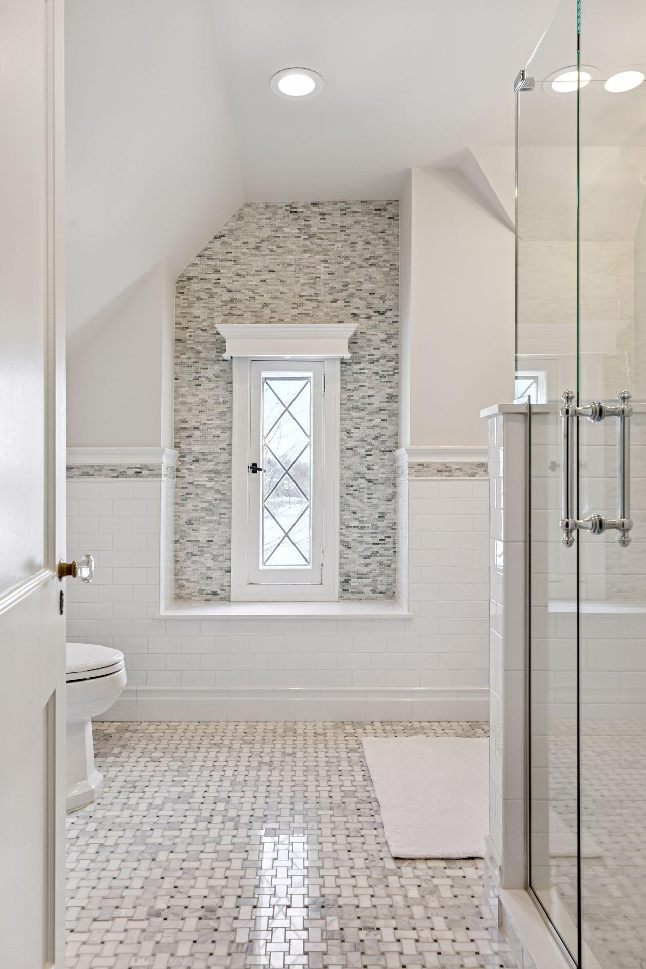 Convenient en suite bath serving the 5th bed, third-floor suite