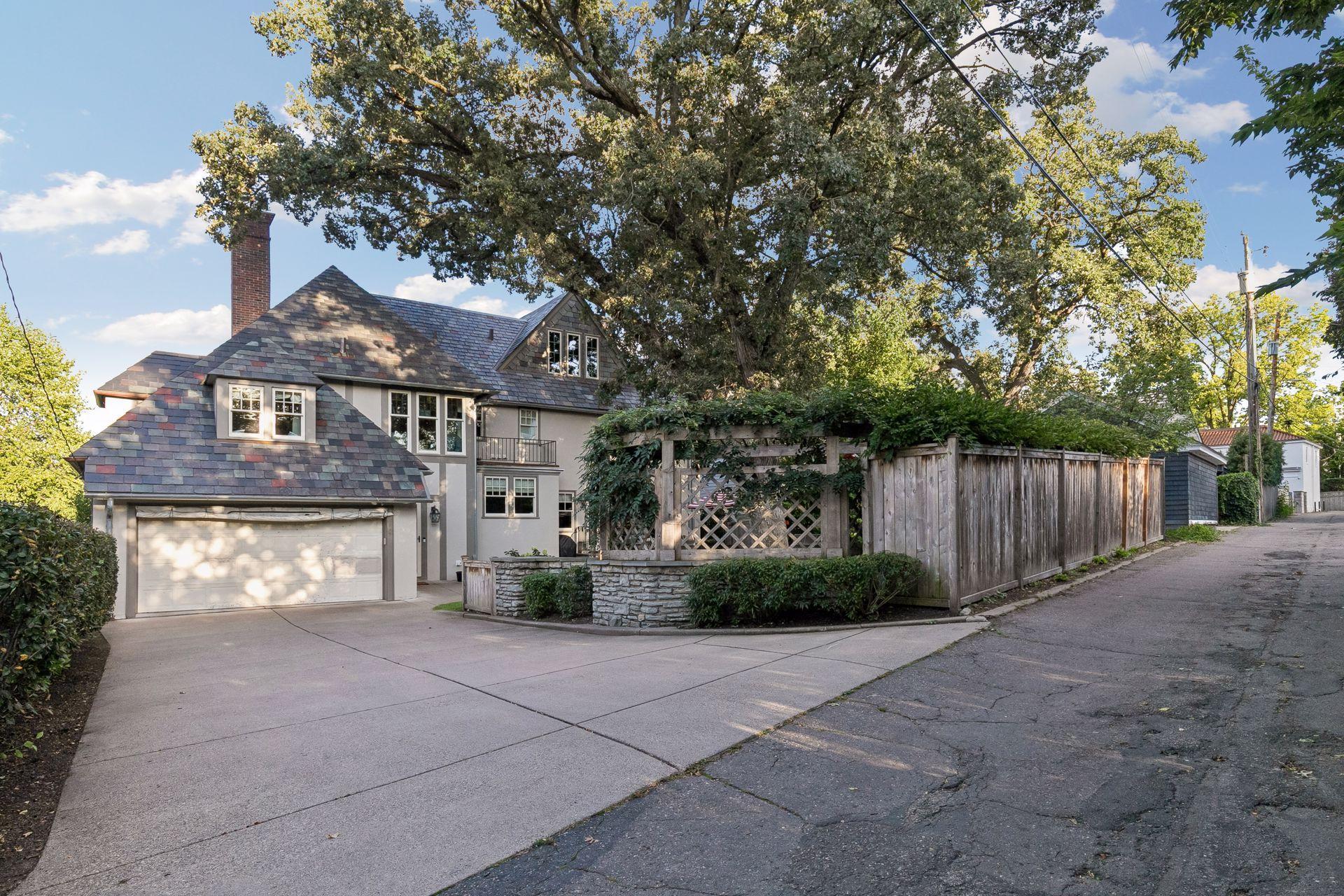 Attached garage and privacy fence top off the