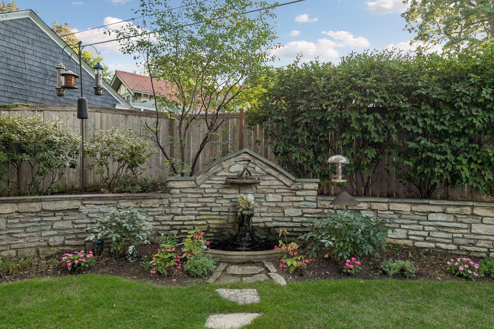 Owners have been meticulously maintaining and restoring original stone wall and sculptures.