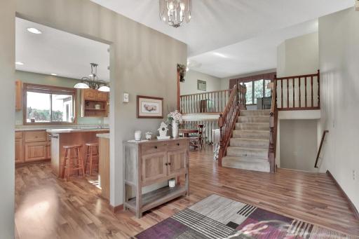 Entry opens to kitchen, dining and living room. (above)