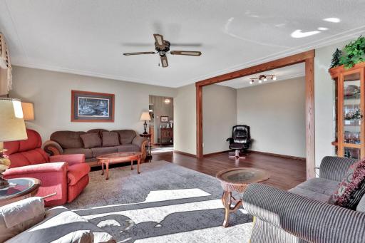 Another view of the main level family room, den area off to the right with the door to the attached garage to the far right (not in photo)