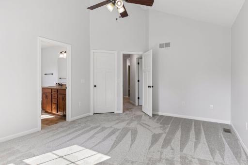 view to the primary bath suite and the walk in closet door