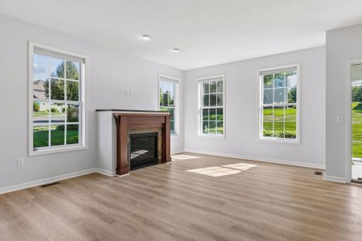 Gas Fireplace and lots of large windows make this space cozy and bright