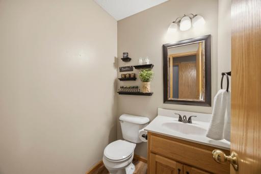 This nicely updated main floor 1/2 bath is conveniently located near the kitchen and main level bedroom/office.