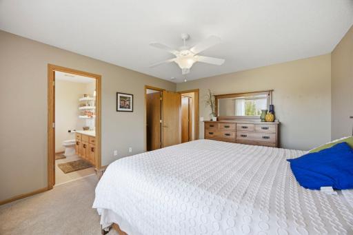Upstairs the primary suite offers a spacious walk-in closet and a full bathroom. The ceiling fan also is ideal in the summer months.