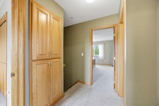 At the top of the stairs landing is additional cabinets for storage.